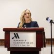 A woman speaking at a podium during a press conference about a school shooting incident in Newport News, Virginia. A woman speaking at a podium during a press conference about a school shooting incident in Newport News, Virginia.
