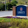 Signage for Liberty University located at the campus entrance. Signage for Liberty University located at the campus entrance.