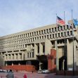 Boston City Hall with three flagpoles displaying the U.S. flag, Massachusetts state flag, and a third empty flagpole. Boston City Hall with three flagpoles displaying the U.S. flag, Massachusetts state flag, and a third empty flagpole.