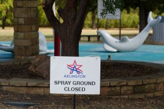 Sign indicating that the spray ground is closed, located in Arlington, Texas.