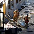 Two firefighters inspecting debris outside the Sandman Hotel after an explosion. Two firefighters inspecting debris outside the Sandman Hotel after an explosion.