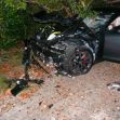 Image of a severely damaged Tesla Model S involved in a crash, with debris scattered around and visible signs of impact. Image of a severely damaged Tesla Model S involved in a crash, with debris scattered around and visible signs of impact.