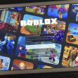 Screenshot of the Roblox login screen displayed on a tablet, featuring various game images in the background. Screenshot of the Roblox login screen displayed on a tablet, featuring various game images in the background.