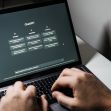 A person using a laptop displaying the ChatGPT interface. A person using a laptop displaying the ChatGPT interface.