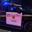 Police vehicle with caution tape reading "POLICE LINE DO NOT CROSS" and "TO PROTECT AND SERVE." Police vehicle with caution tape reading "POLICE LINE DO NOT CROSS" and "TO PROTECT AND SERVE."