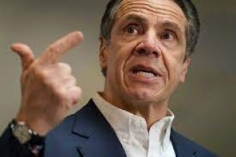 Image of New York Governor Andrew Cuomo speaking, gesturing with his hand.