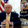 Former President Donald Trump seated at a desk in the Oval Office, with a serious expression. Former President Donald Trump seated at a desk in the Oval Office, with a serious expression.