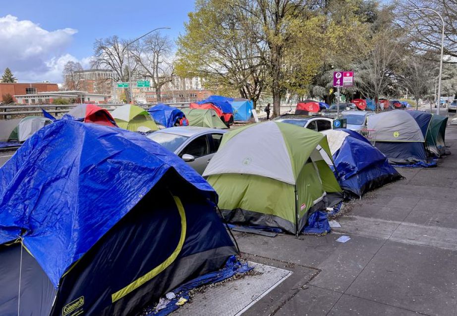 Tents line both sides of Southwest 13th Avenue in Portland, April 4, 2022.