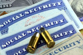 Image depicting Social Security cards with bullets, symbolizing the intersection of legal and financial consequences in cases of homicide.
