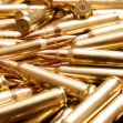 Close-up of a pile of brass ammunition cartridges. Close-up of a pile of brass ammunition cartridges.