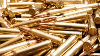 Close-up of a pile of brass ammunition cartridges.