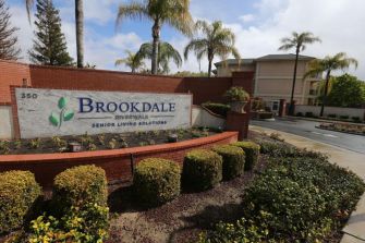 Signage at a Brookdale Senior Living facility, highlighting the company's name and branding.