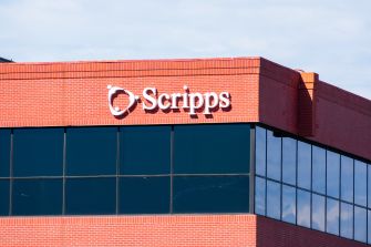Building exterior with the Scripps logo against a blue sky.