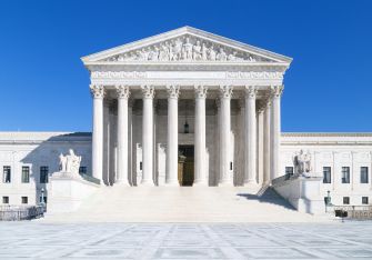 Image of the U.S. Supreme Court building on a clear blue day.