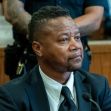 Cuba Gooding, Jr. seated in a courtroom during a legal proceeding. Cuba Gooding, Jr. seated in a courtroom during a legal proceeding.