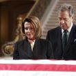 Nancy Pelosi and Paul Pelosi somberly pay their respects at a ceremony. Nancy Pelosi and Paul Pelosi somberly pay their respects at a ceremony.