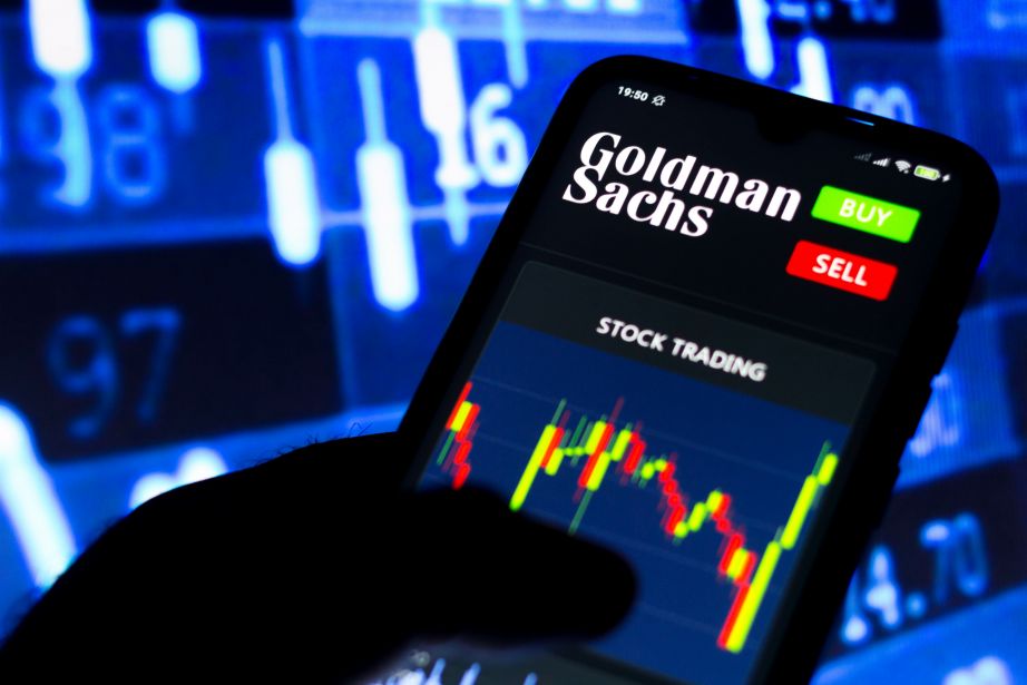 Goldman Sachs on phone and stock background