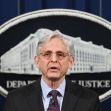 Merrick Garland, Attorney General of the United States, speaking at a press conference in front of the Department of Justice seal. Merrick Garland, Attorney General of the United States, speaking at a press conference in front of the Department of Justice seal.