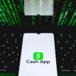 Cash App logo displayed on a smartphone with a backdrop of green digital code. Cash App logo displayed on a smartphone with a backdrop of green digital code.