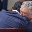 Alec Baldwin and a supporter embrace in a courtroom following the dismissal of involuntary manslaughter charges against him. Alec Baldwin and a supporter embrace in a courtroom following the dismissal of involuntary manslaughter charges against him.