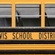 Image of a yellow school bus with the words "Davis School District" displayed on the side. Image of a yellow school bus with the words "Davis School District" displayed on the side.
