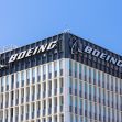 Boeing headquarters building with the company logo displayed prominently on the upper facade. Boeing headquarters building with the company logo displayed prominently on the upper facade.