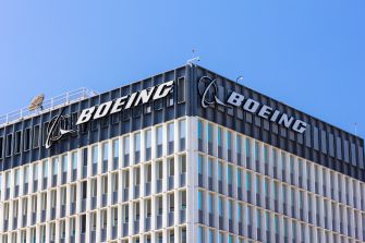 Boeing headquarters building with the company logo displayed prominently on the upper facade.