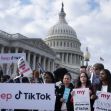 Protesters holding signs in support of TikTok in front of the U.S. Capitol building. Protesters holding signs in support of TikTok in front of the U.S. Capitol building.