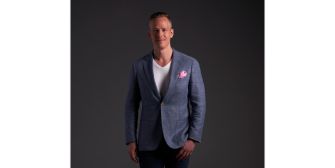 Former contestant from 'Love Is Blind' posing in a formal outfit.