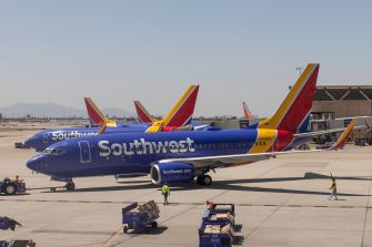 Southwest Airlines planes on the tarmac at an airport.