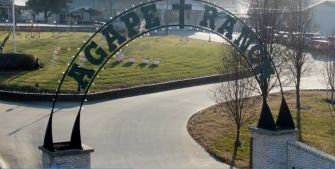 Sign at the entrance of Agape Boarding School for Boys in Stockton, Missouri.