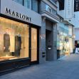 A view of the Marlowe retail store in San Francisco, showcasing its window display and the surrounding shopping area. A view of the Marlowe retail store in San Francisco, showcasing its window display and the surrounding shopping area.