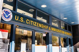 U.S. Citizenship and Immigration Services office entrance, highlighting the agency involved in asylum and immigration cases.