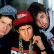 Iconic rap group posing in a retro style, featuring distinctive fashion and expressions. Iconic rap group posing in a retro style, featuring distinctive fashion and expressions.