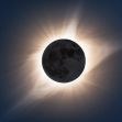 Image of a solar eclipse, showing the moon partially covering the sun with rays of light emanating from around the edges. Image of a solar eclipse, showing the moon partially covering the sun with rays of light emanating from around the edges.