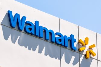 Walmart store sign against a clear blue sky.