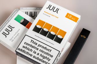 Juul e-cigarette products and packaging featuring mango nectar flavor.