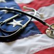 A stethoscope resting on an American flag, symbolizing healthcare and service members. A stethoscope resting on an American flag, symbolizing healthcare and service members.