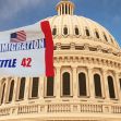 Flag depicting "Immigration Title 42" in front of a government building. Flag depicting "Immigration Title 42" in front of a government building.