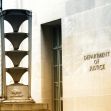 Building facade with the inscription "Department of Justice." Building facade with the inscription "Department of Justice."