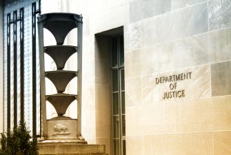 Building facade with the inscription "Department of Justice."