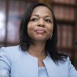 Assistant Attorney General Kristen Clarke speaking during a press event. Assistant Attorney General Kristen Clarke speaking during a press event.