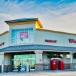 Exterior view of a Walgreens store with a pharmacy sign. Exterior view of a Walgreens store with a pharmacy sign.