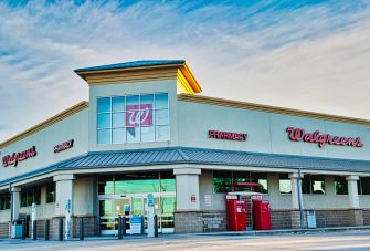 Exterior view of a Walgreens store with a pharmacy sign.