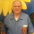 Elderly man in prison uniform smiling against a colorful mural backdrop, symbolizing his release after 31 years for nonviolent marijuana charges. Elderly man in prison uniform smiling against a colorful mural backdrop, symbolizing his release after 31 years for nonviolent marijuana charges.