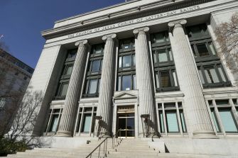 Exterior view of the headquarters of the Church of Jesus Christ of Latter-Day Saints, featuring grand columns and entrance stairs.