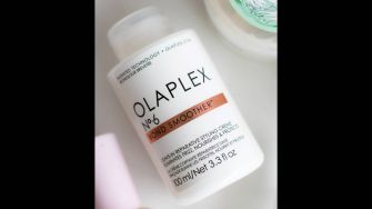 Olaplex No. 6 Bond Smoother hair product bottle on a surface.