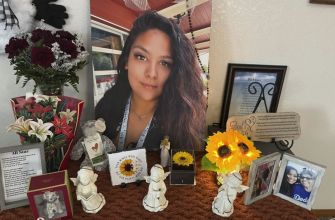 A memorial display honoring Stephanie Cosme, featuring photographs, flowers, and mementos.