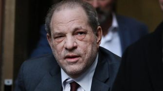 Harvey Weinstein leaving a court building, facing legal scrutiny following the overturning of his rape conviction by the New York State Court of Appeals.