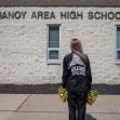 A cheerleader stands outside Mahanoy Area High School, reflecting on the implications of her social media post and the Supreme Court case regarding student free speech rights. A cheerleader stands outside Mahanoy Area High School, reflecting on the implications of her social media post and the Supreme Court case regarding student free speech rights.
